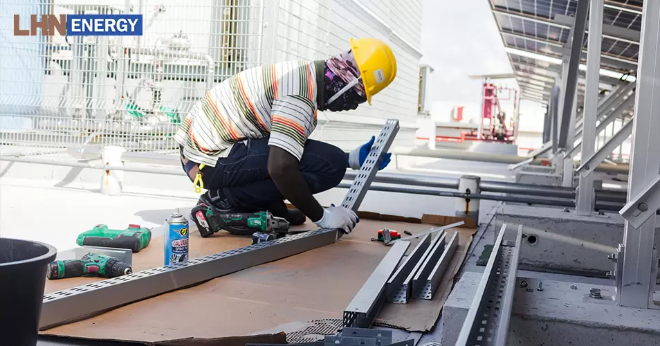 a worker installing solar panels