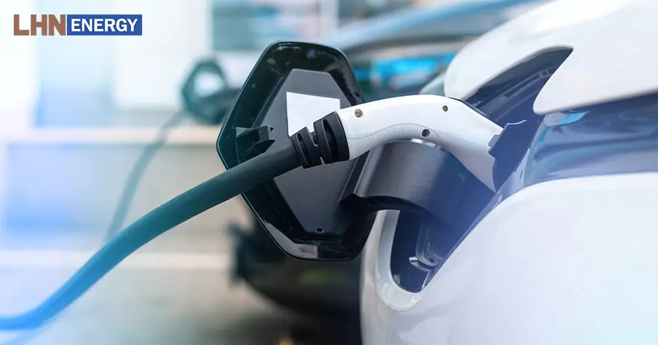 Electric car recharging at an ev charging station